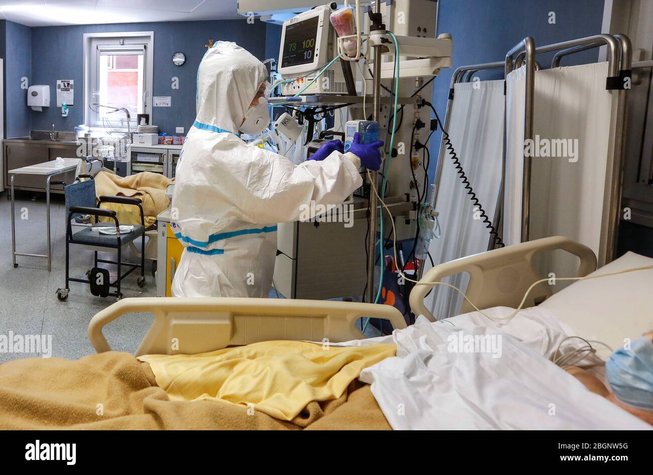 Rome, Italy. 19th Apr, 2020. A medical staffer wearing protective outfit assists patients in an Intensive Care unit's Covid-19 department at the San Filippo Neri hospital. Stock Photo