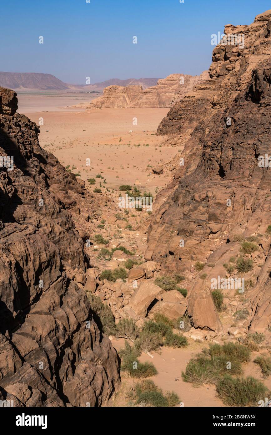 Jordan, Wadi Rum Protected Area, A canyon through the mountains to desert  below in the Wadi Rum Protected Area, a UNESCO World Heritage Site Stock  Photo - Alamy