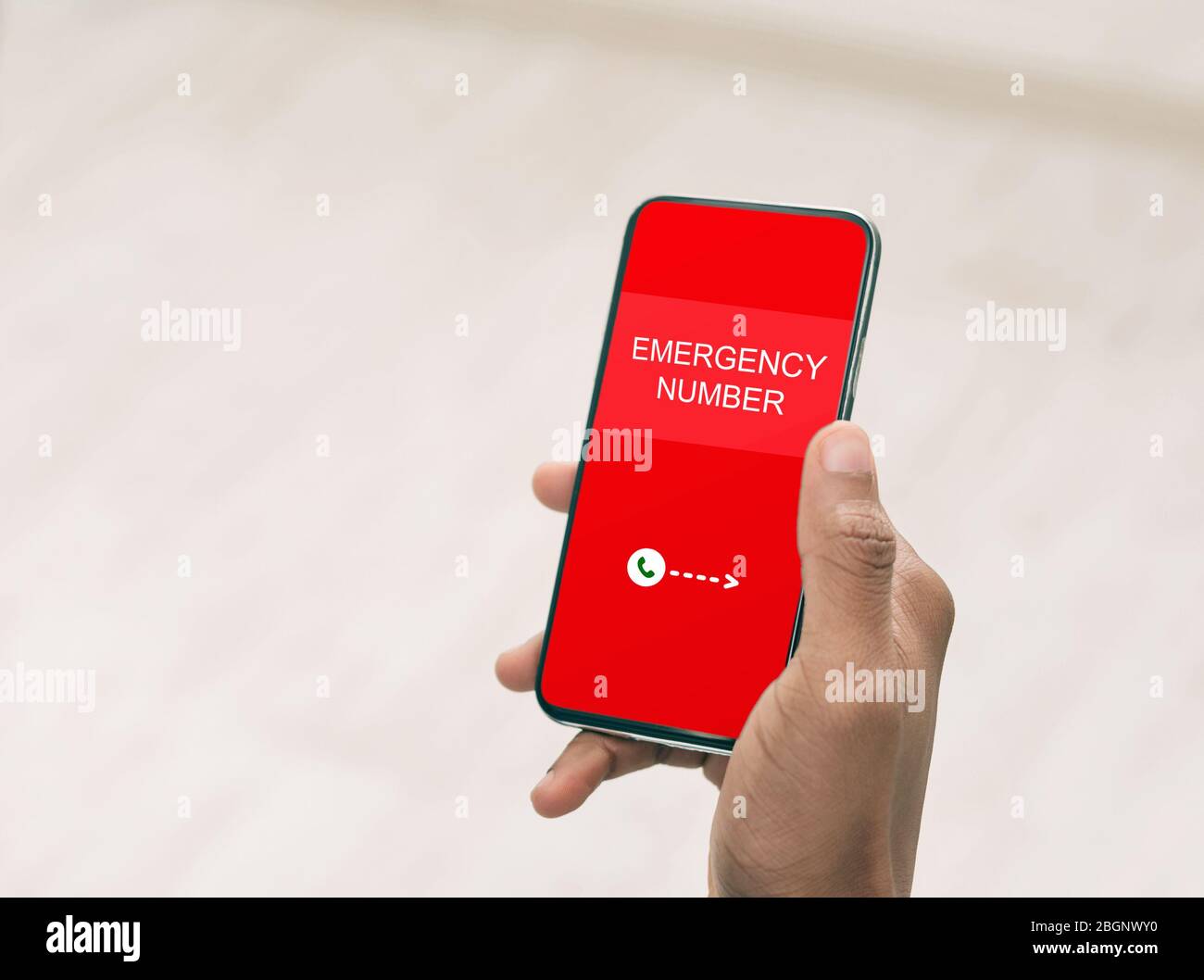 Man holding smart phone with emergency number Stock Photo Alamy