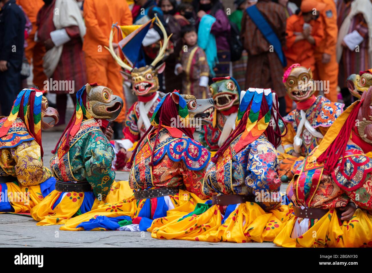 Bhutan, Punakha Dzong. Punakha Drubchen Festival, masked performers in colorful attire. Stock Photo