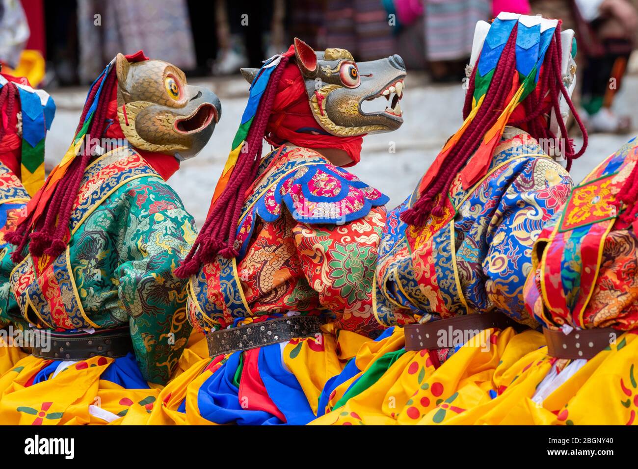 Bhutan, Punakha Dzong. Punakha Drubchen Festival, masked performers in colorful attire. Stock Photo