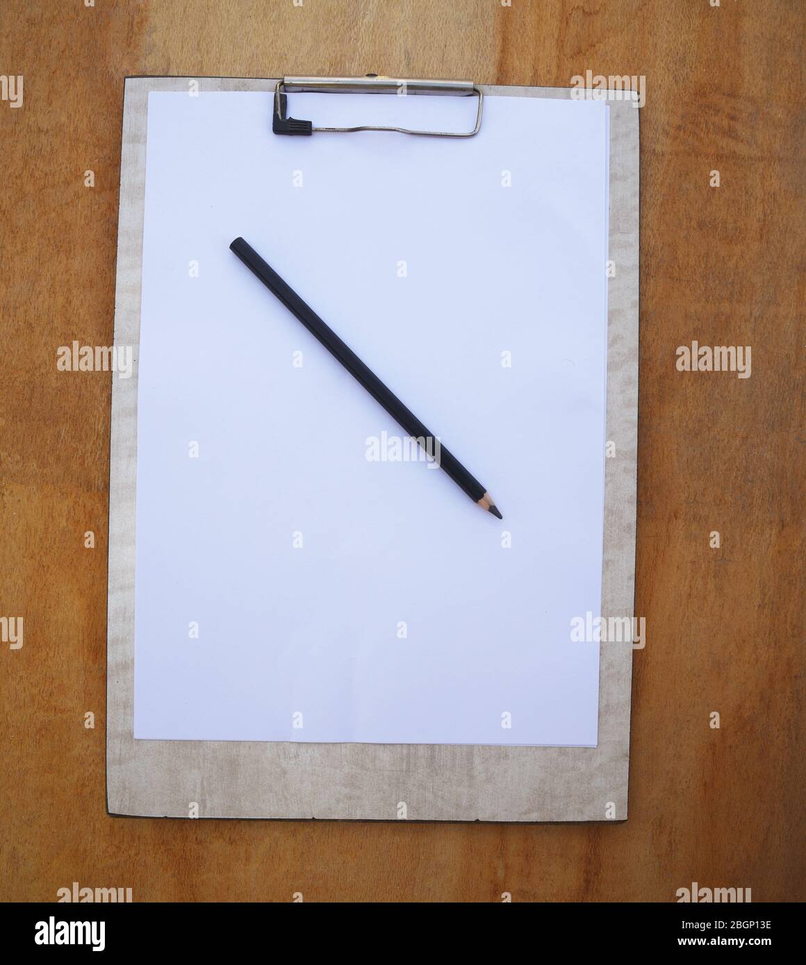 empty white paper/book on wooden background Stock Photo