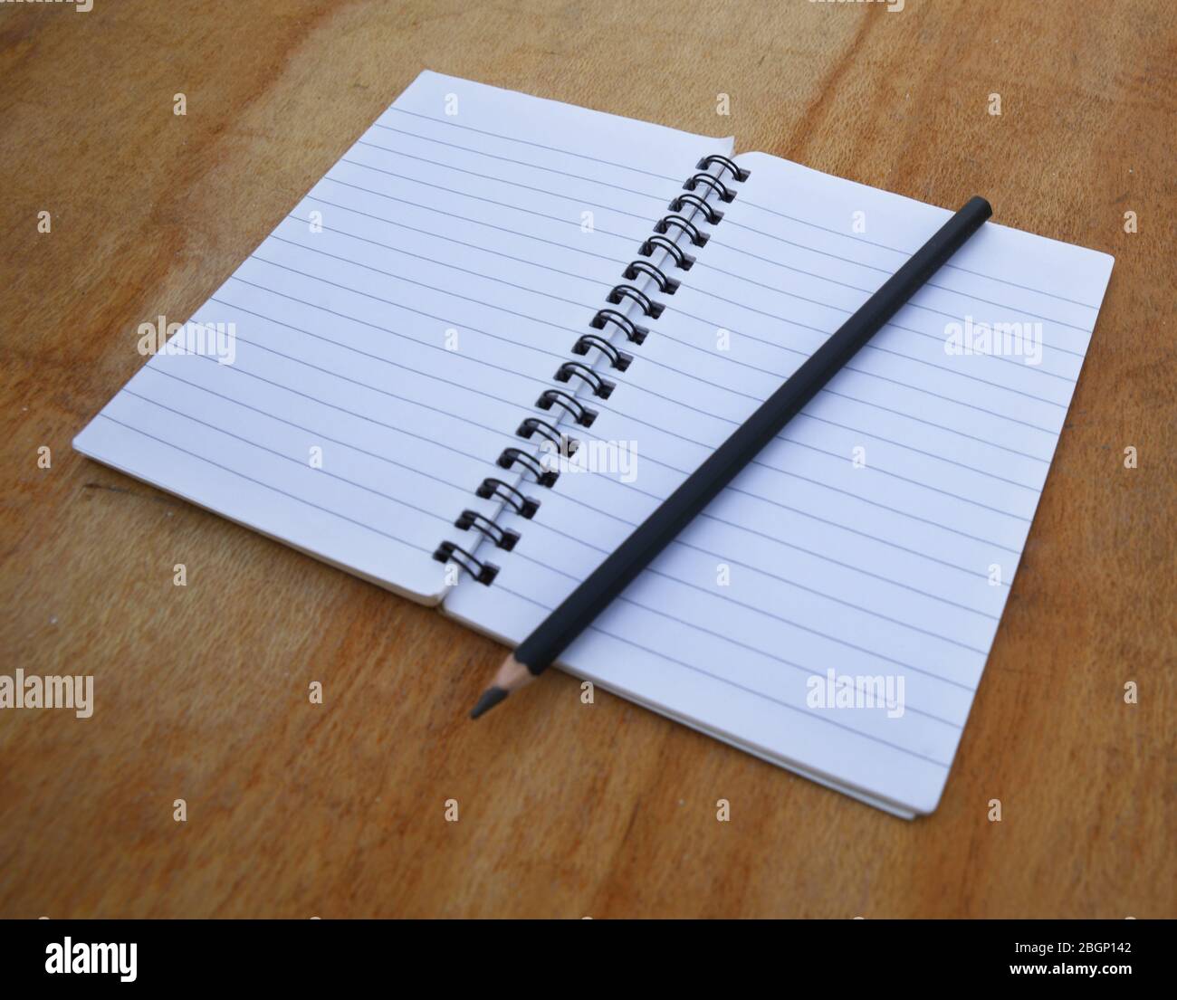 empty white paper/book on wooden background Stock Photo