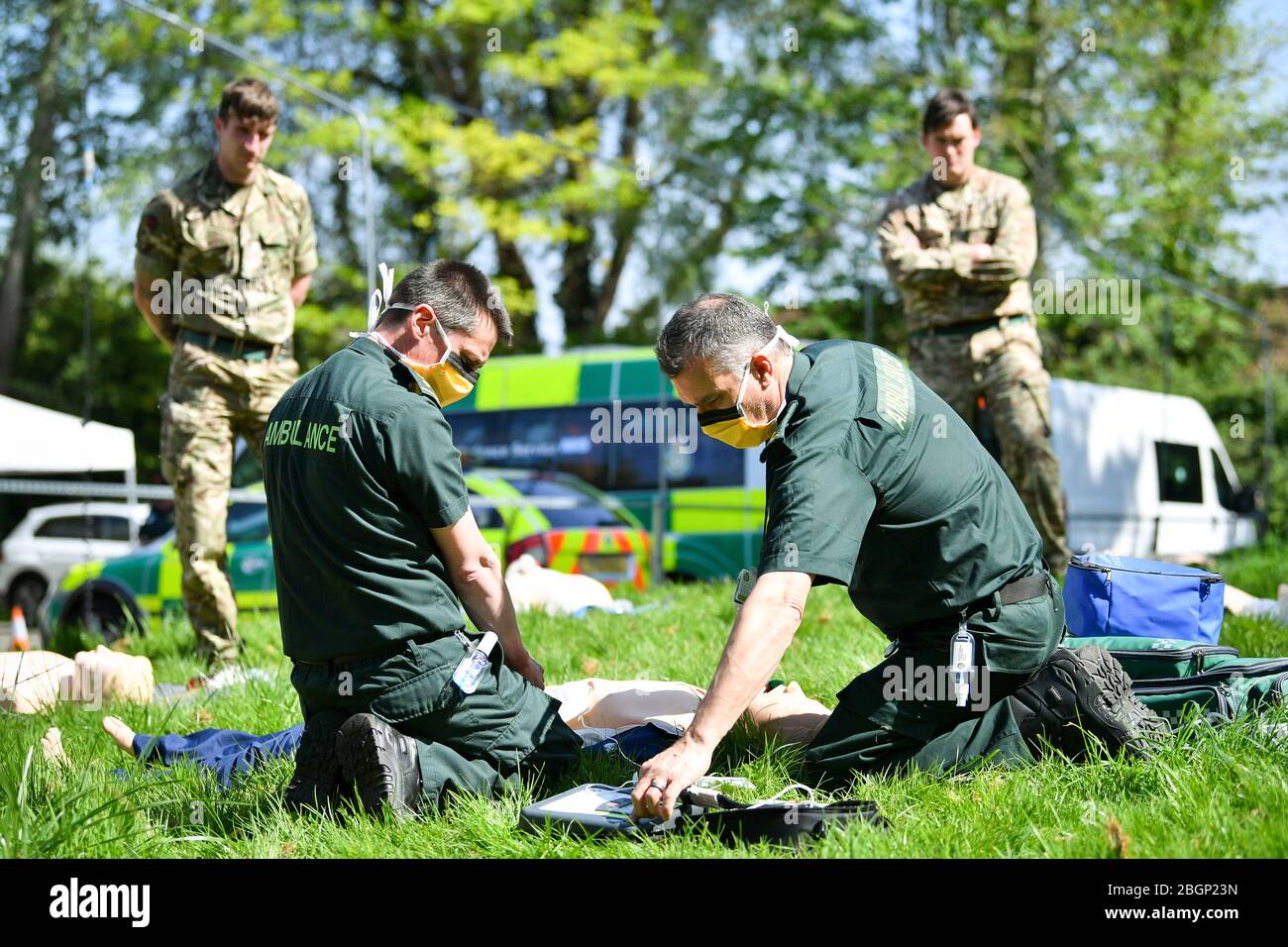Military personnel from 1st Battalion, Royal Welsh watch as Learning