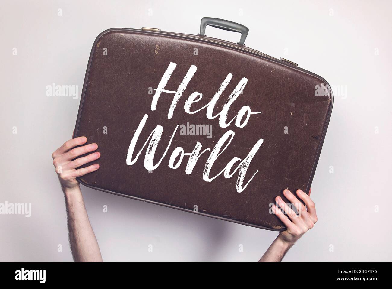Hello World message on a vintage travel suitcase Stock Photo