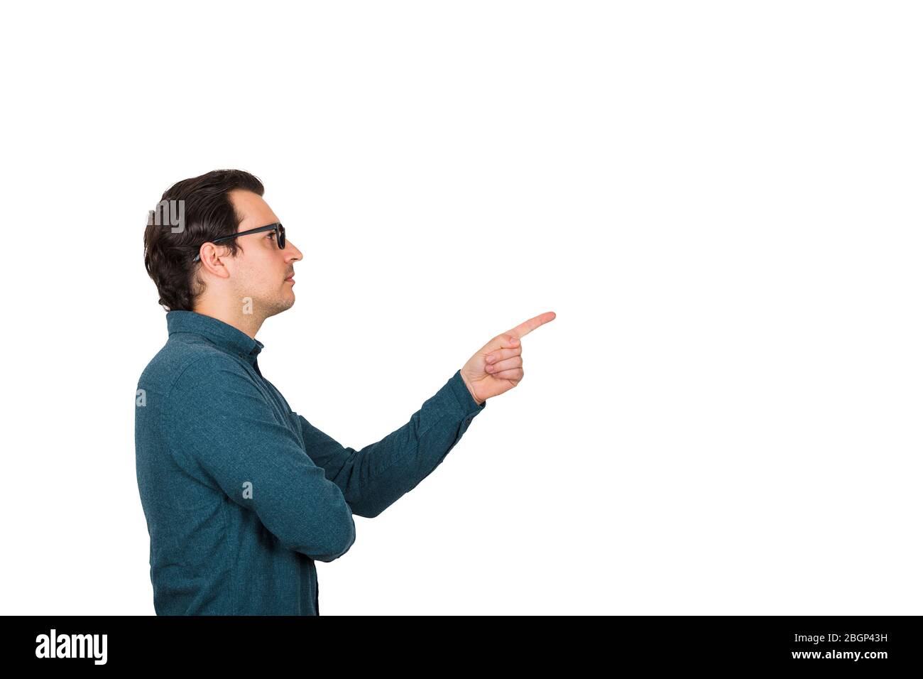 Side view of angry businessman pointing index finger blaming someone as guilty or choosing something, isolated on white background with copy space. Se Stock Photo
