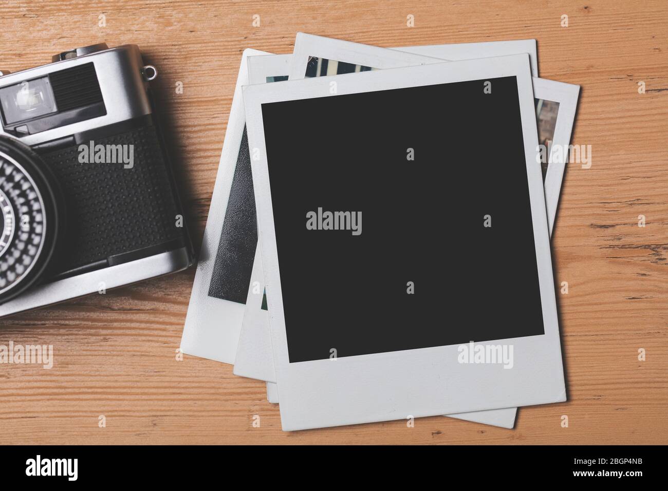 vintage retro camera with a blank instant photograph frame Stock Photo