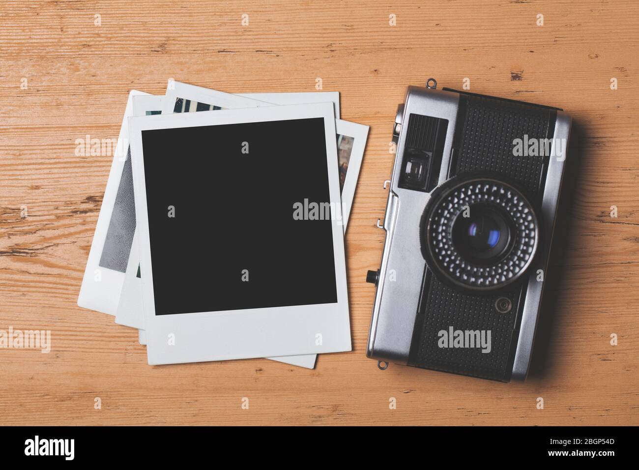 vintage retro camera with a blank instant photograph frame Stock Photo