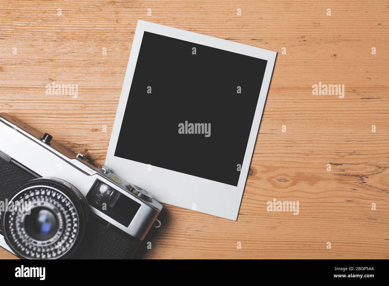 vintage retro camera with a blank instant photograph frame Stock Photo