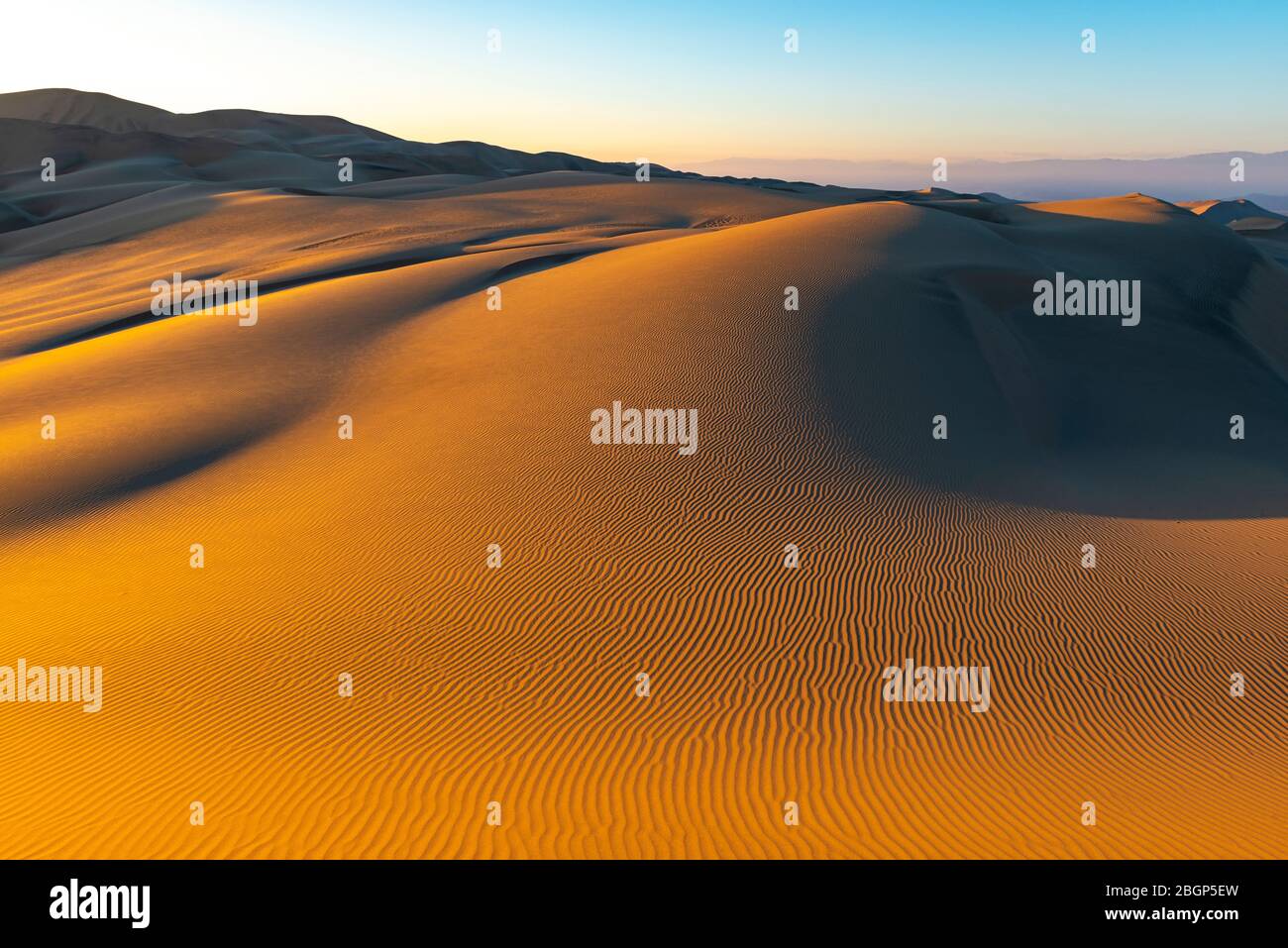 Sunset in the desert of Peru with sand ripples in a large sand dune between Ica and Huacachina. Stock Photo