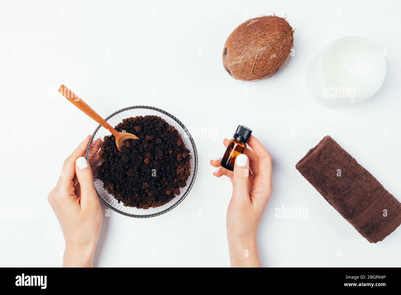 Young Woman Hands Mixing Homemade Natural Body Scrub Made Of Ground Coffee Coconut Oil And Aromatic Essence Top View On White Table Stock Photo Alamy