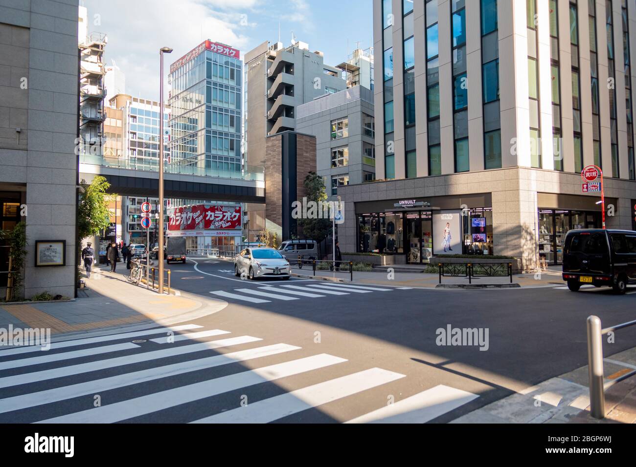 The crosswalk with the Japanese people walking around. Tokyo, Japan