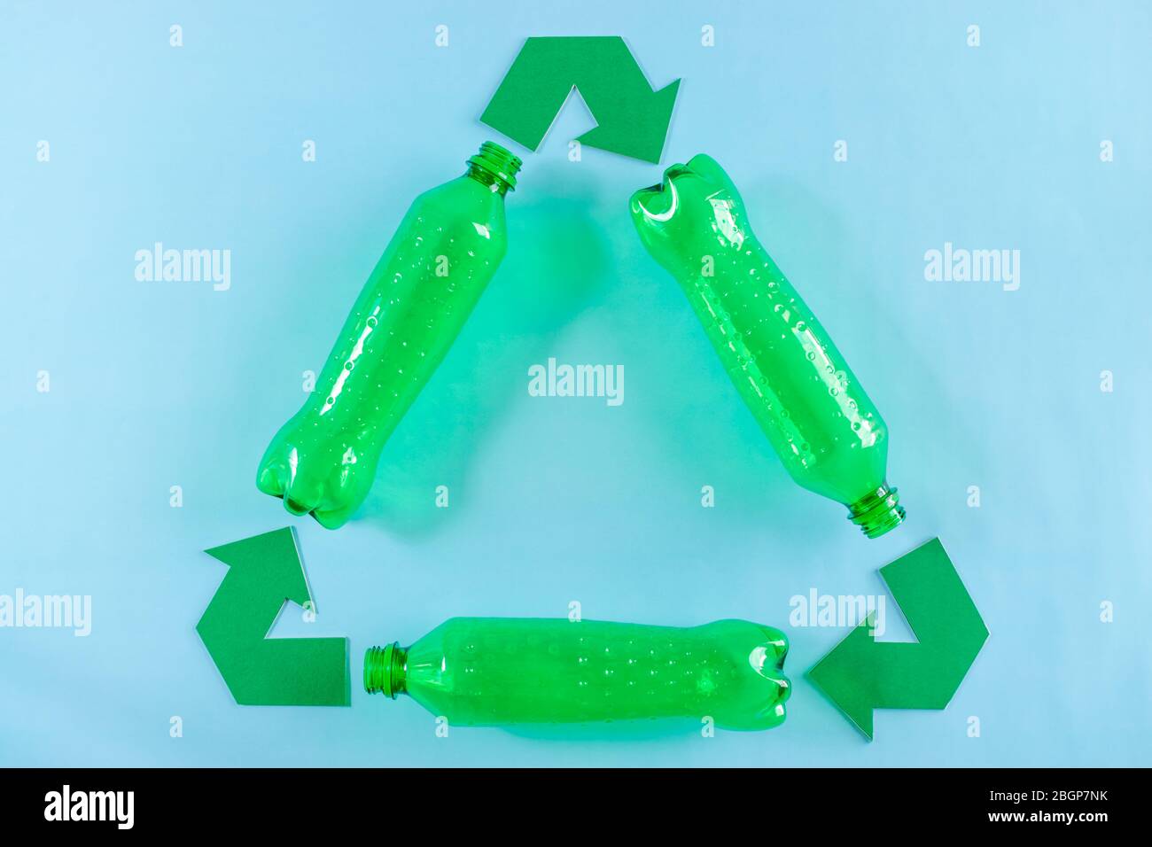 Plastic bottles and recycling symbol with arrows. Recycle plastic
