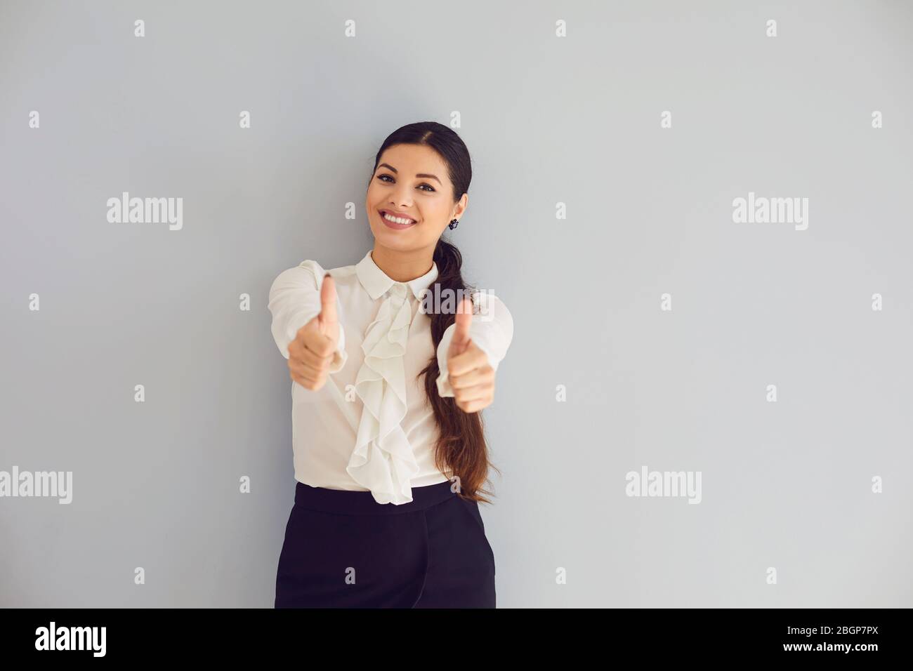Happy hispanic woman thumbs up hi-res stock photography and images - Alamy