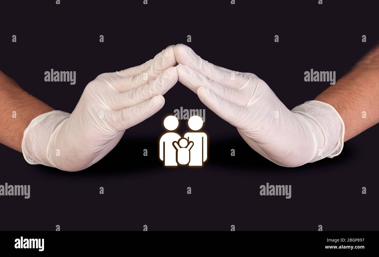 Doctors Hands with gloves protecting family medical and healthcare concept Stock Photo