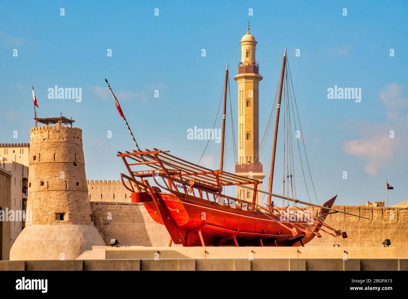 Dhow (traditional sailing vessel) outside the Dubai Museum in the Al Fahidi Fort, Dubai, UAE Stock Photo