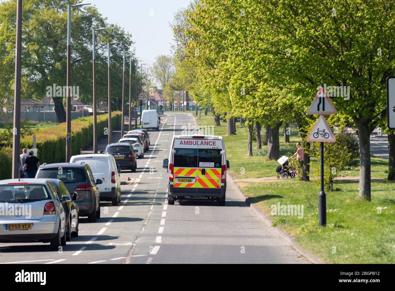 Ambulance on Prittlewell Chase heading to Southend Hospital COVID-19 Coronavirus pandemic lockdown period in Westcliff, Southend on Sea, Essex, UK Stock Photo