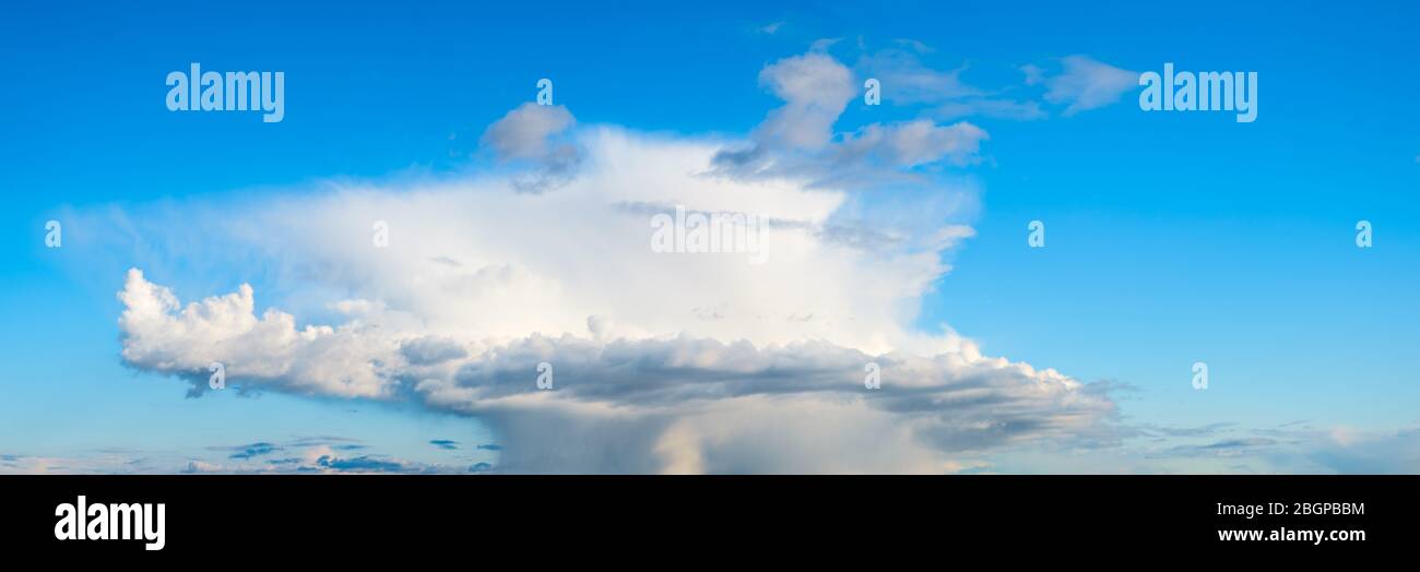 Spring Cyclone Front Blue sky panorama with white clouds of cyclone front. Summer spring ...