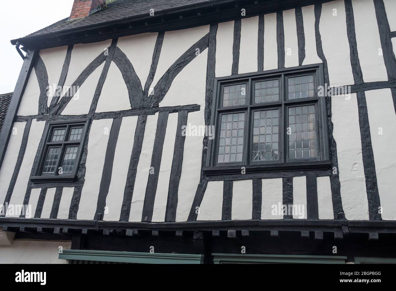 Leaded windows in old wood frame building steep hill lincoln 2019 Stock Photo