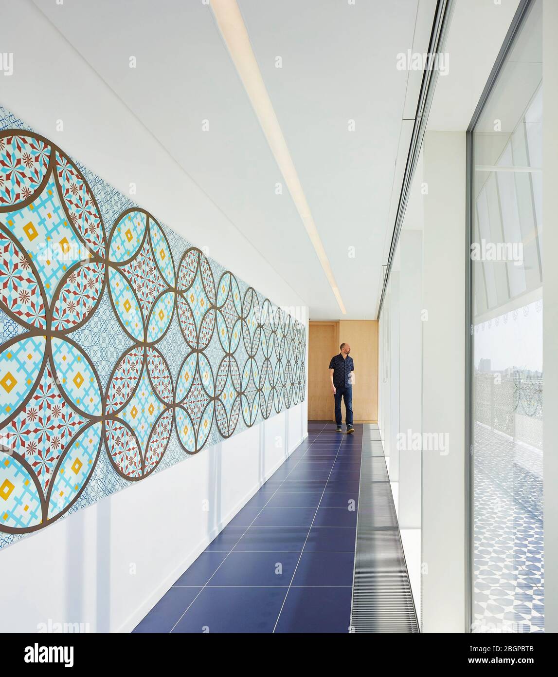 Interior corridor view. Aga Khan Centre Kings Cross, London, United Kingdom. Architect: Maki and Associates, 2018. Stock Photo