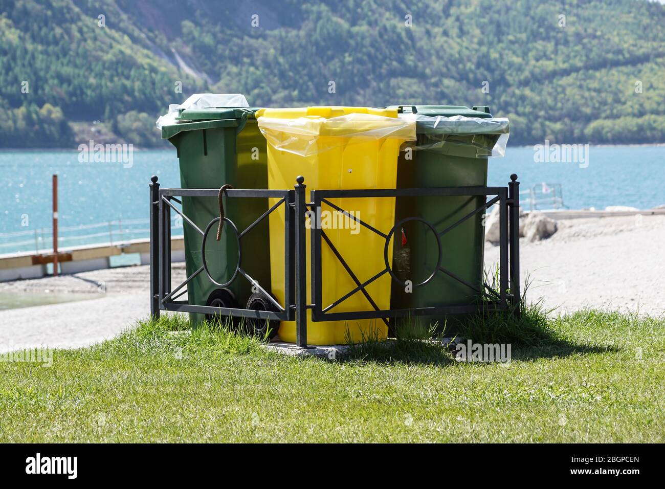 Different Colored Bins For Collection Of Recycle Materials Stock Photo
