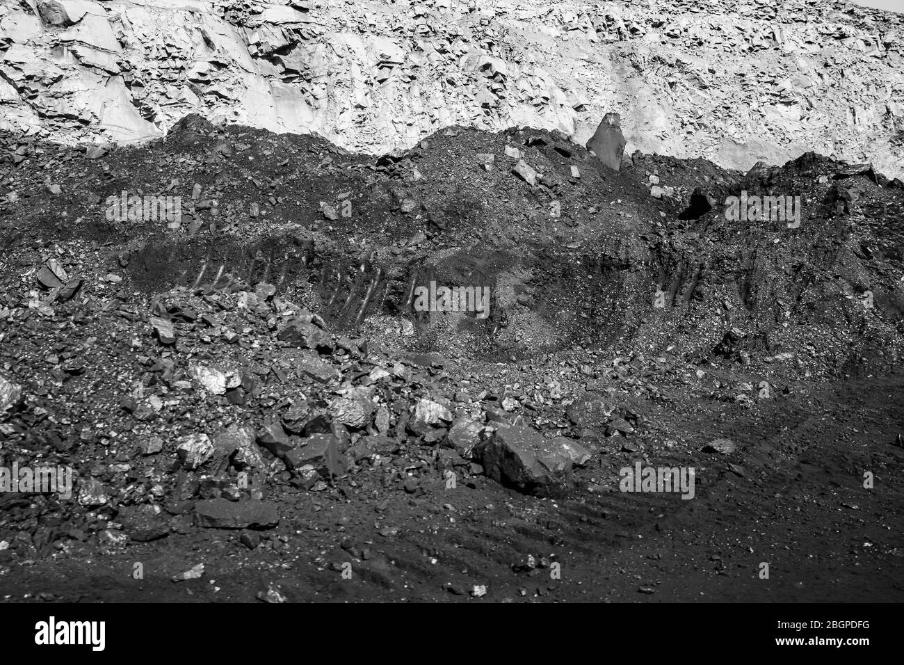 Geological section of soil, layers of coal and rock. Overburden open mine anthracite. Dark texture black color Stock Photo