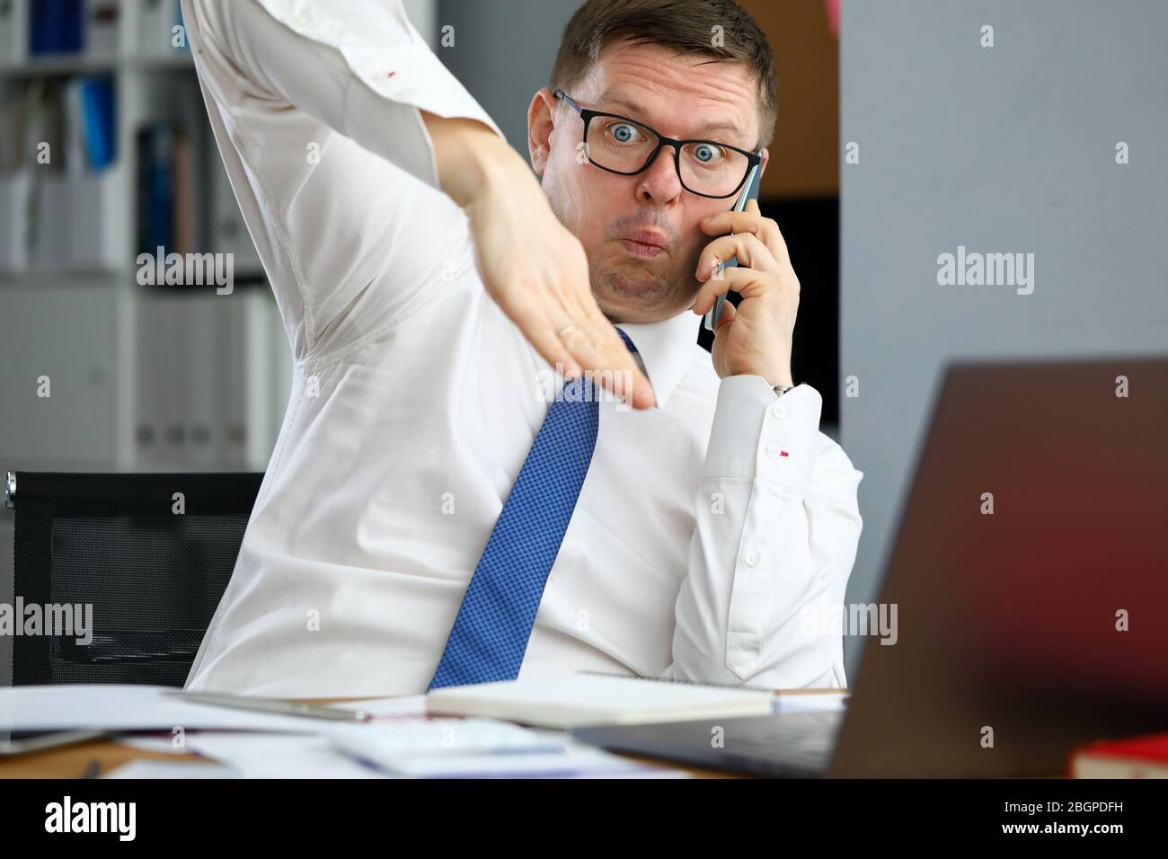 Male executive talking cellphone about bad consequences Stock Photo