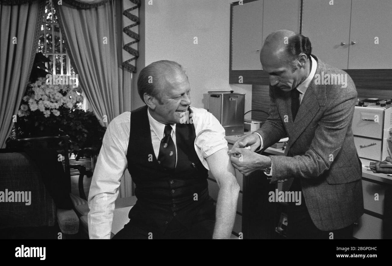 President Gerald R. Ford receives a swine flu innoculation from his White House physician, Dr. William Lukash, Washington, DC, 10/14/1976. Photo by David Hume Kennerly/Gerald R Ford Library Stock Photo