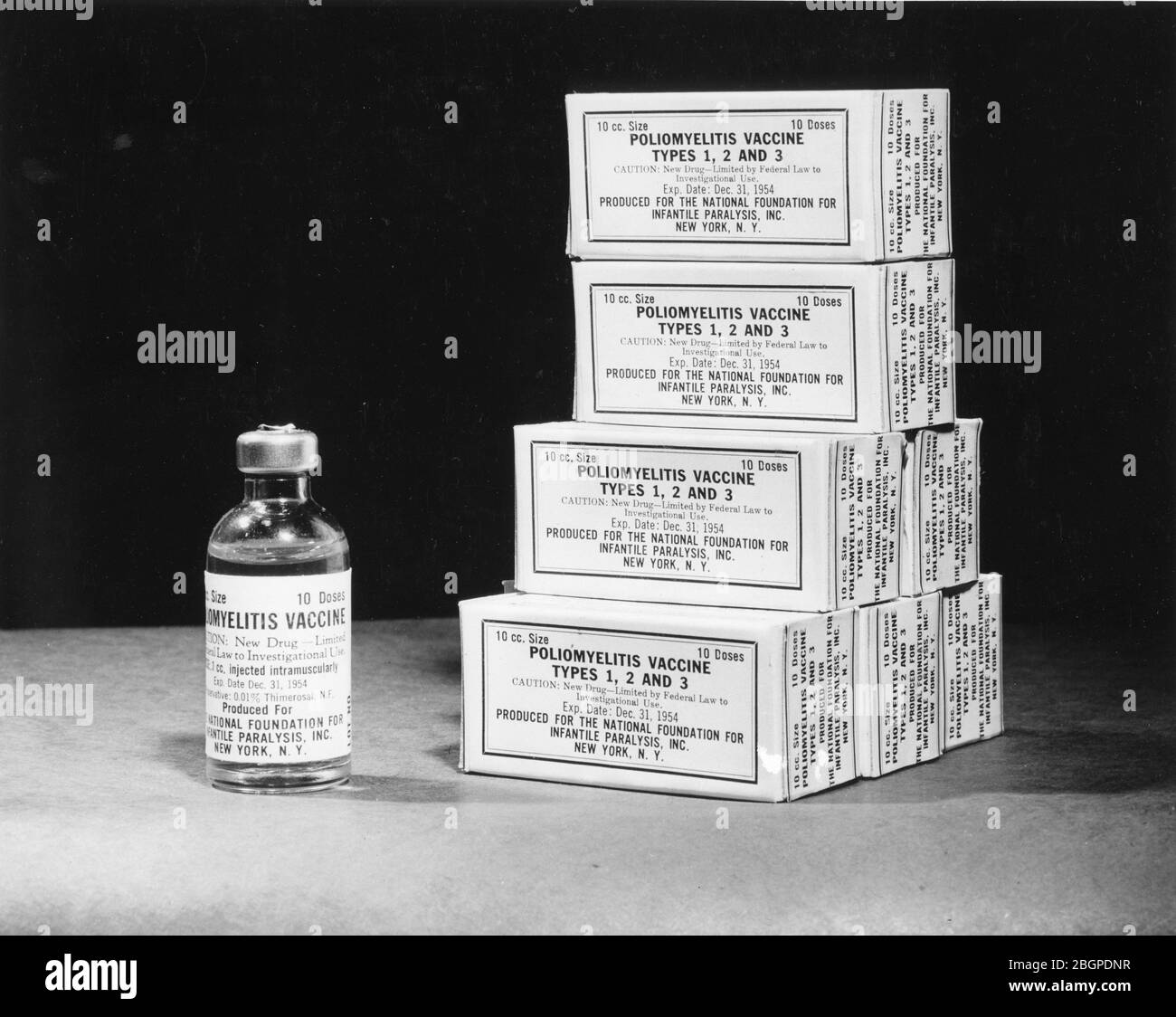 Life-sized photo of the 10-cc polio vaccine bottle which will be used in  field trials against the deadly disease. The bottle contains enough vaccine to give ten school children their first 1-cc shot. Washington, DC, 1954. Photo by National Foundation for Infantile Paralysis. Stock Photo