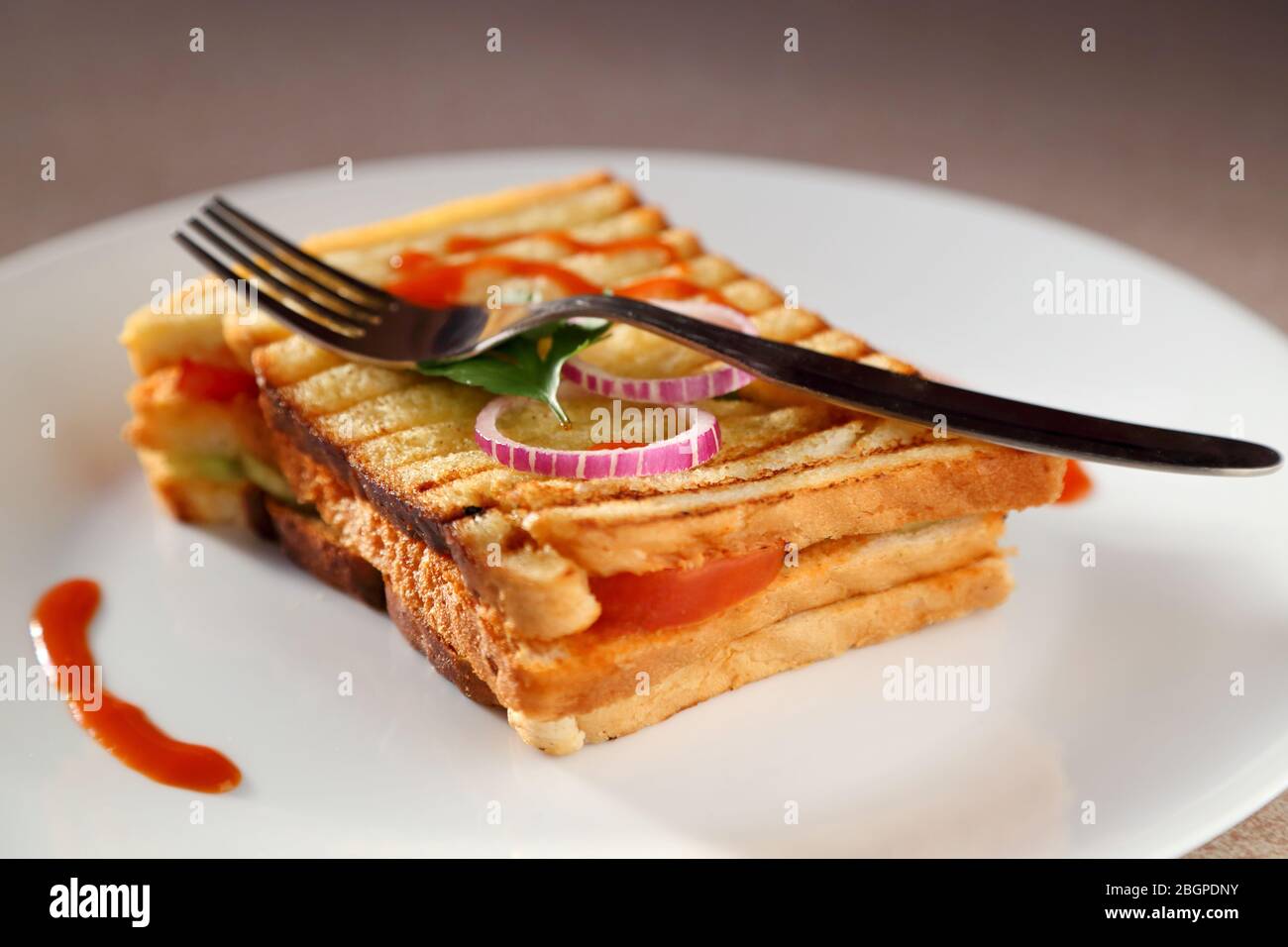 A sandwich in a white ceramic plate Stock Photo Alamy