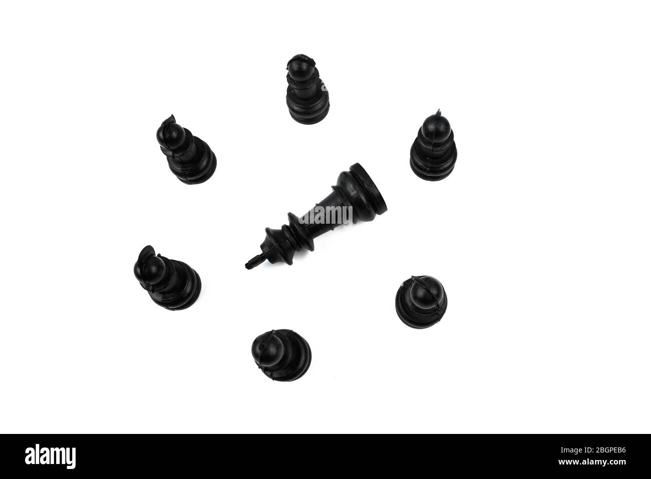 The black king placed in the middle of six different black pawns making a round circle Stock Photo