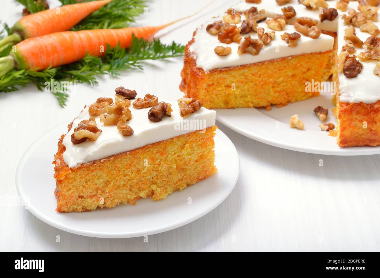 Appetizing piece of carrot cake on white plate Stock Photo