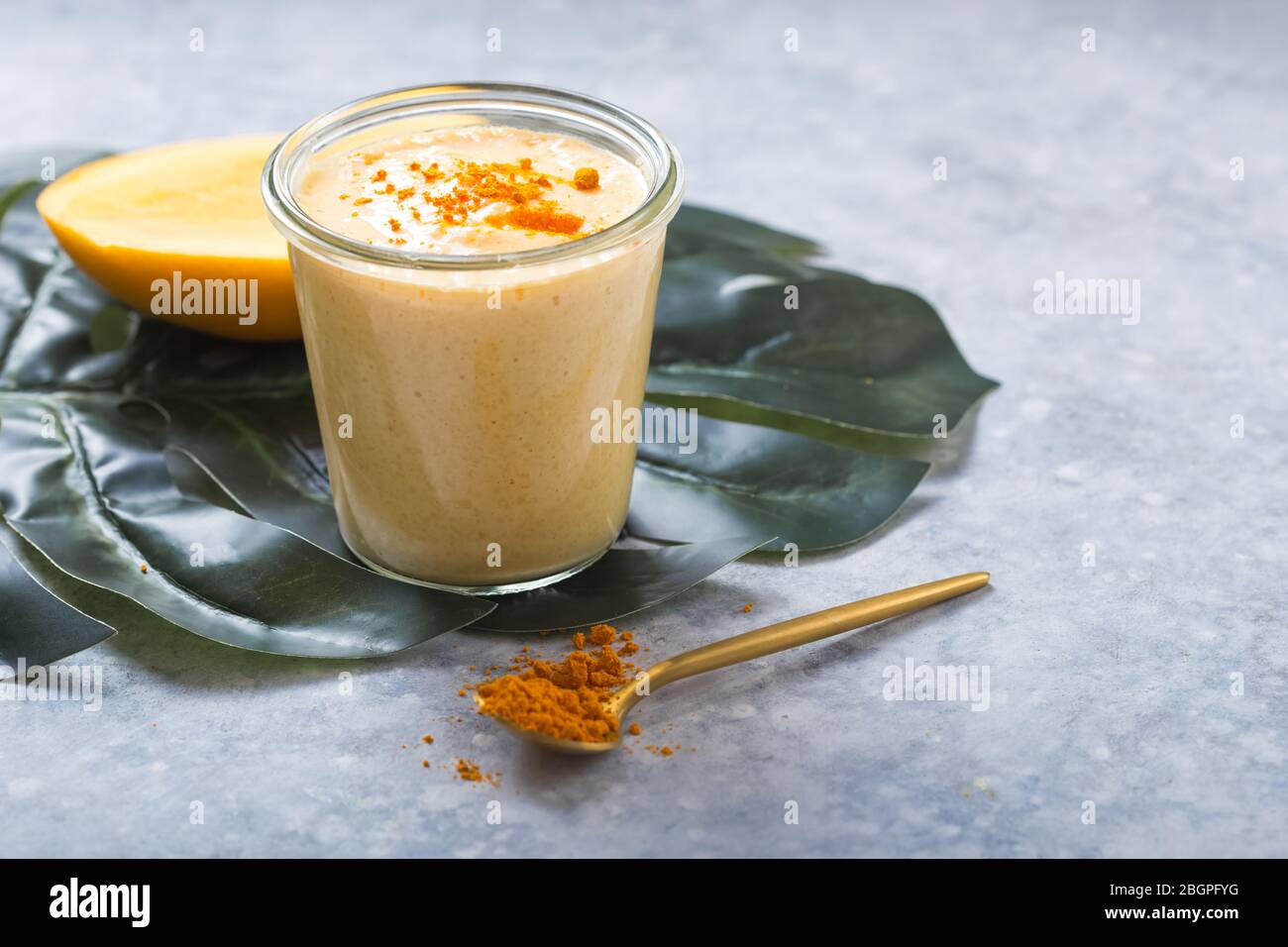 yellow mango yogurt or smoothie on grey background turmeric lassie or lassi in glass stock photo alamy https www alamy com yellow mango yogurt or smoothie on grey background turmeric lassie or lassi in glass image354537332 html