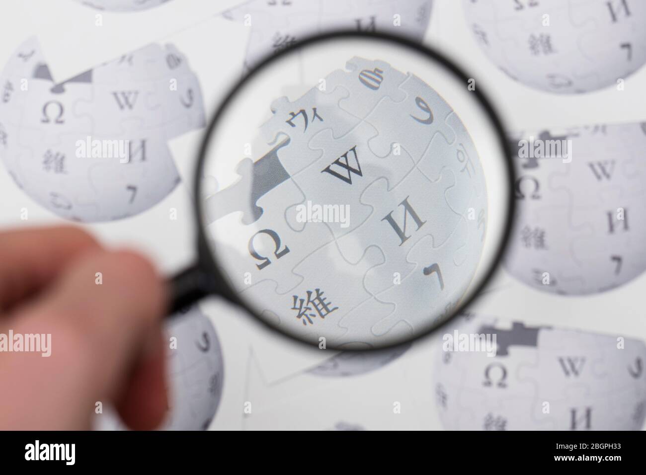 OXFORD, UK - FEB 16 2017: Wikipedia online encyclopedia logo printed on paper Stock Photo