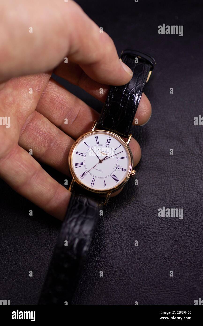 Saint-Imier, Switzerland 31.03.2020 - Closeup image of Longines watch in  the male palm Longines man watch stainless steel case white clock face dial  Stock Photo - Alamy