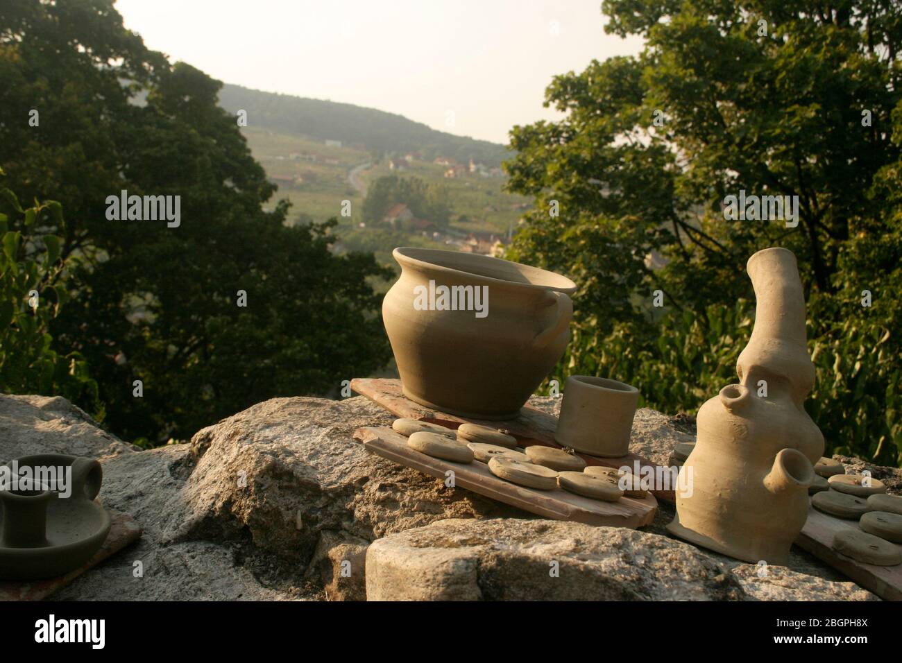 Clay molded into different shapes, drying in the sun Stock Photo