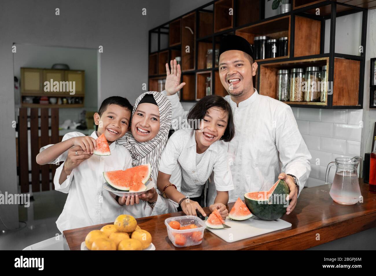 muslim asian family and kids preparing for fasting break on ramadan Stock Photo