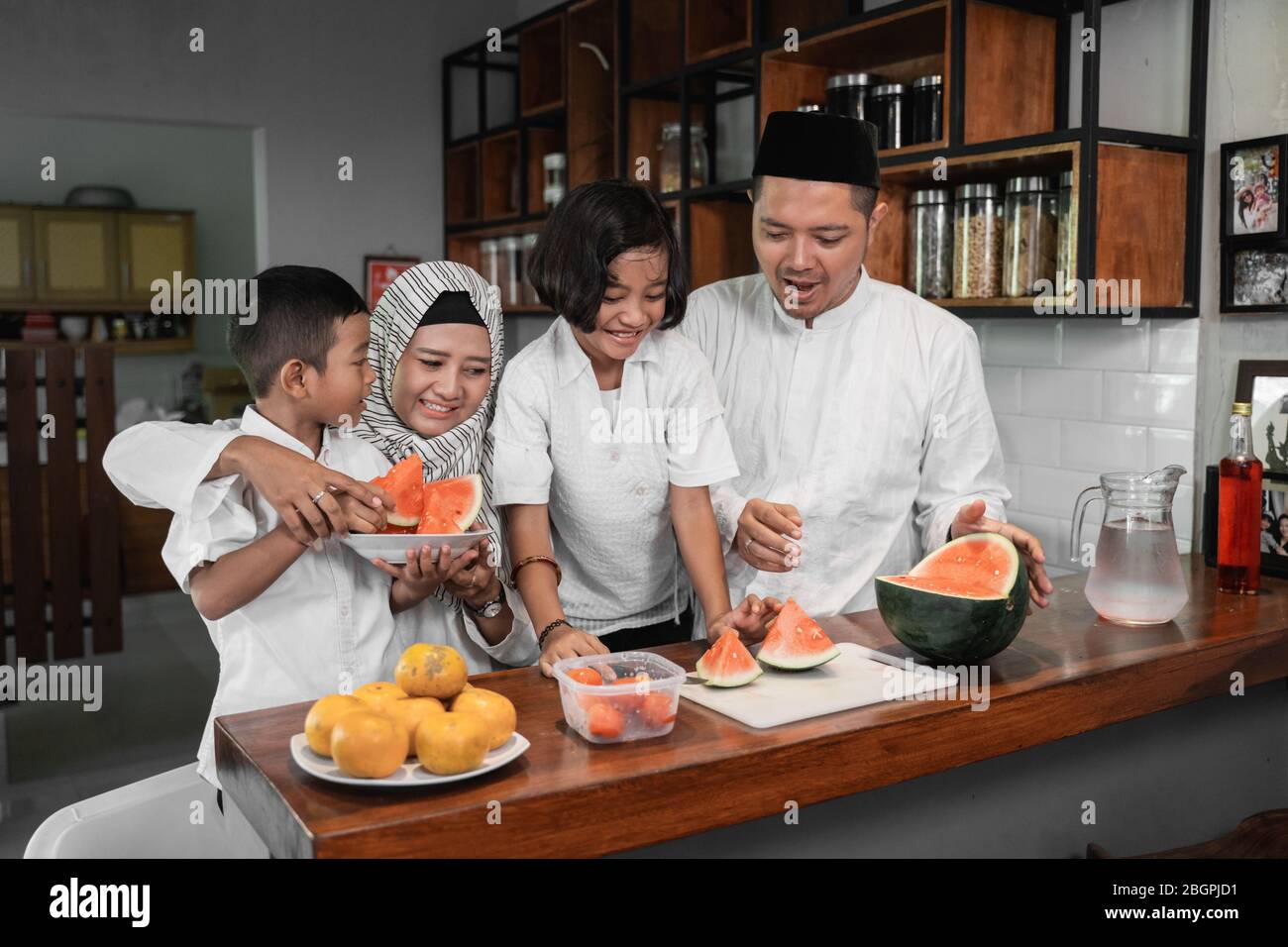 muslim asian family breaking the fast together Stock Photo