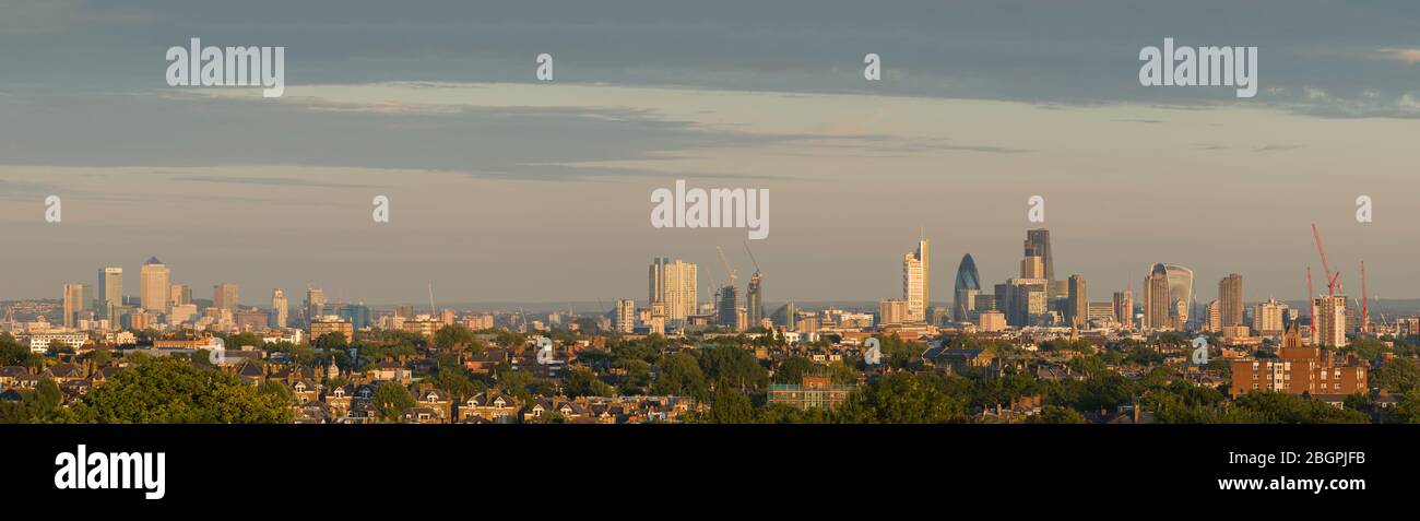 A panoramic view across London, on the left is Canary Wharf and on the right is the City of London. Photo taken from Highgate West Hill, London, UK. Stock Photo