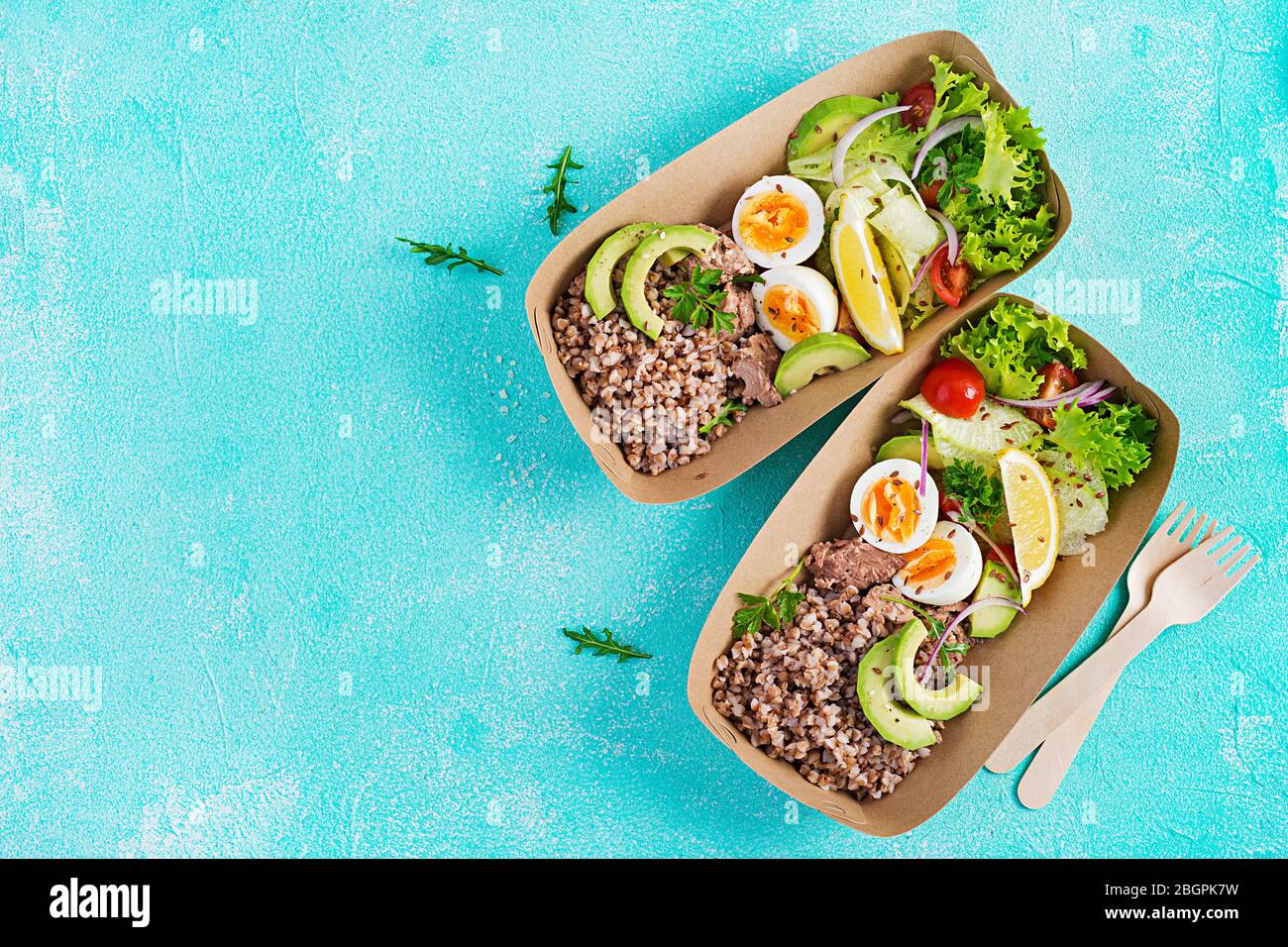 Healthy food delivery. Lunch Buckwheat porridge, sliced tuna, boiled egg and fresh vegetable