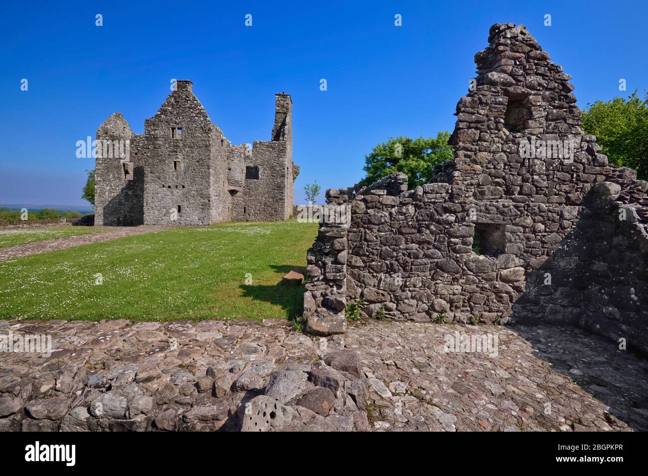 Ireland, County Fermanagh,  Ruin of Tully Castle on the shores of Lough Erne which was a fortified house with a rectangular bawn built for Sir John Hume, a Scottish planter, in 1619. Stock Photo