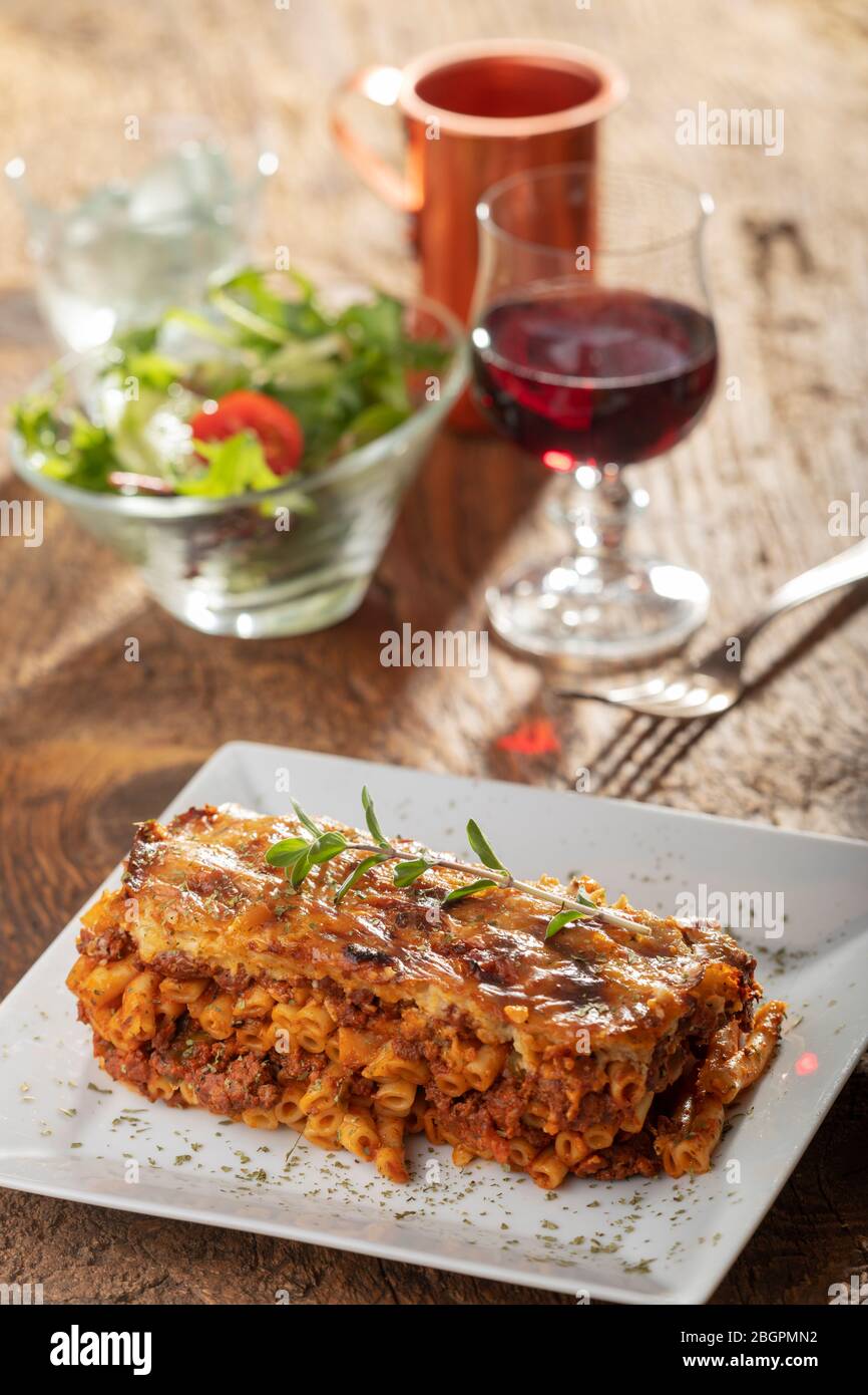 greek pastizio noodle dish with cheese Stock Photo - Alamy