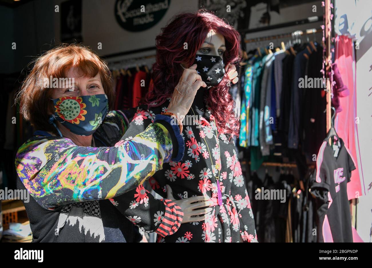 Berlin, Germany. 22nd Apr, 2020. Shop owner Sabine Dopheide is making self-sewn mouthguards on a mannequin in her shop 'fezzl'. Smaller shops are allowed to open again under certain conditions as of today. Credit: Bernd von Jutrczenka/dpa/Alamy Live News Stock Photo