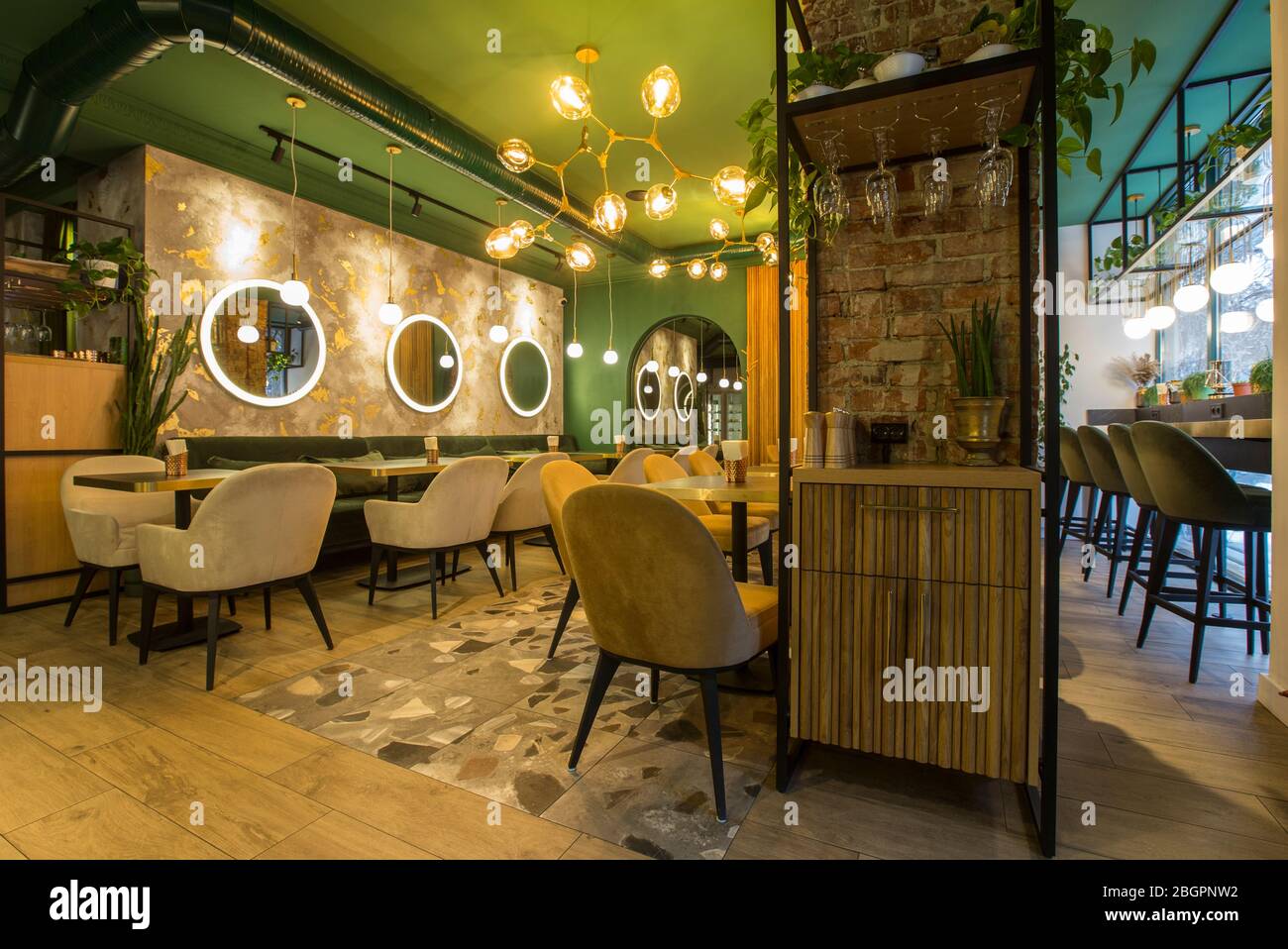 Urban cafe interior with cozy atmosphere, avocado color walls Stock Photo -  Alamy