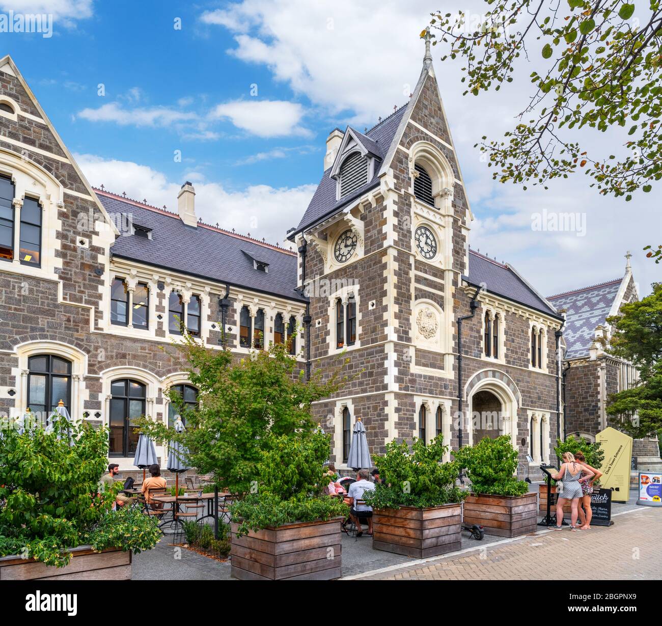 Cafe and Clock Tower Entrance to the Christchurch Arts Centre, Christchurch, New Zealand Stock Photo