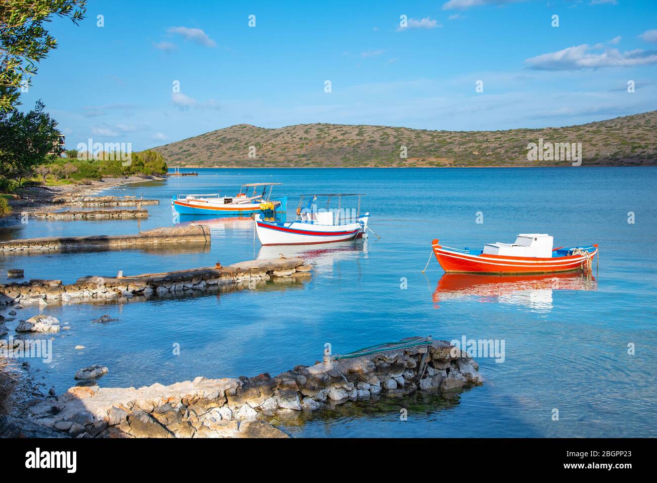 Sailing boat anchored in the peaceful gulf of Elounda, Crete, Greece. Stock Photo