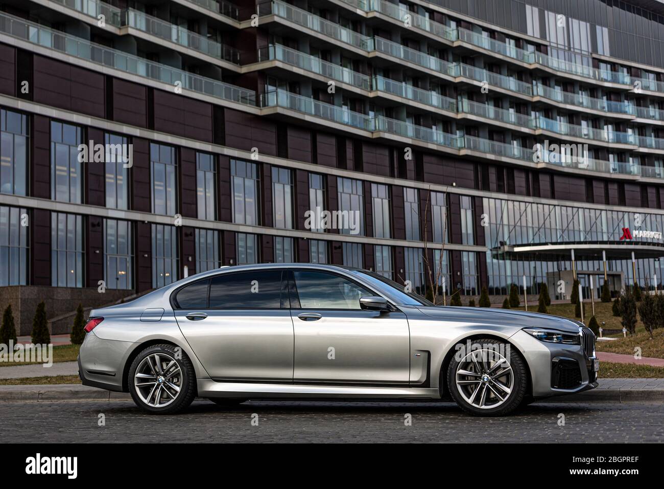 Bmw 7 Near The Louis Vuitton Clothing Store Stock Photo - Download