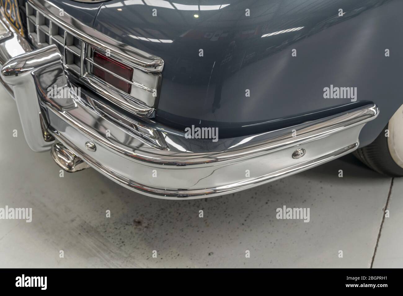 detail of chrome plated rear bumper and light of vintage car. shot at Wanaka, Otago, South Island, New Zealand Stock Photo
