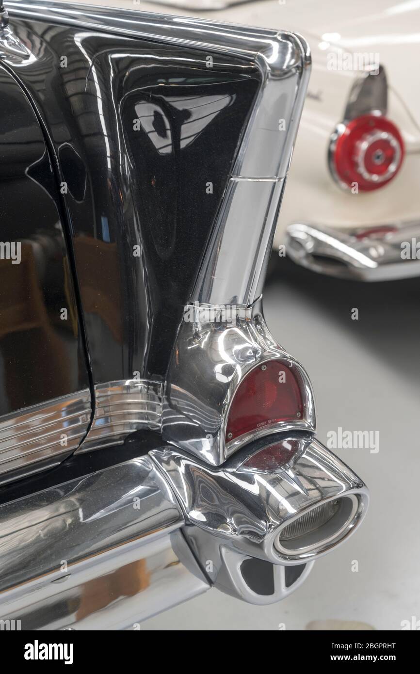 detail of chrome plated fin, rear lights and bumper of vintage 50's car ...