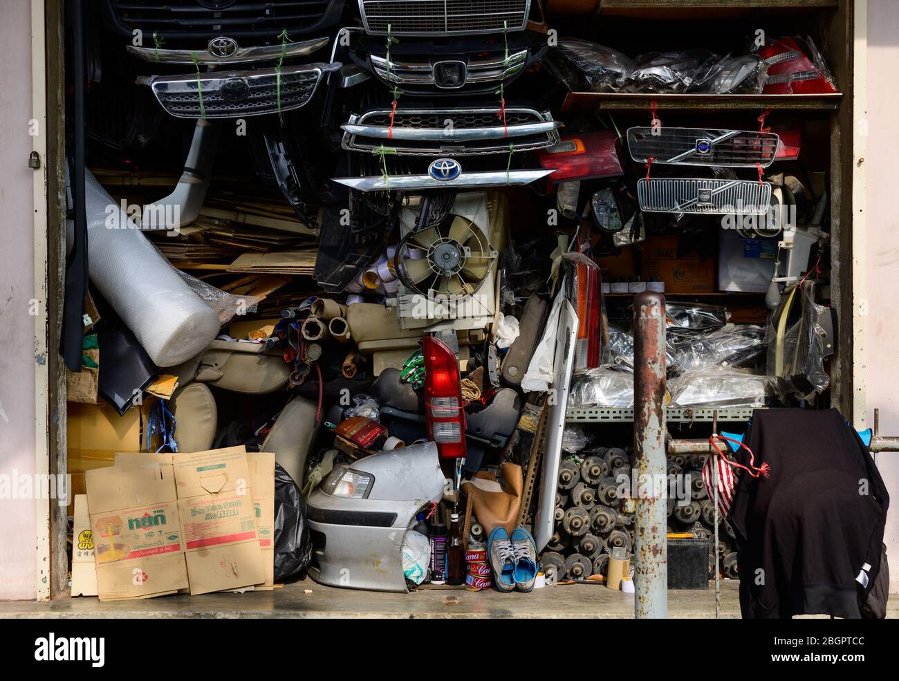 Messy background of thousands of small and rusty parts of crushed and broken cars Stock Photo